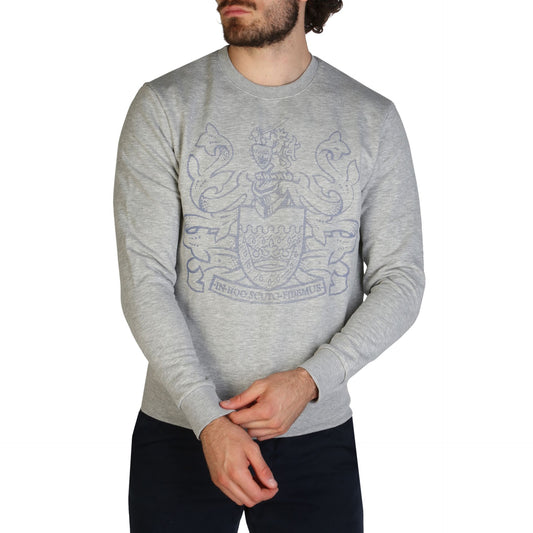 Classic grey Aquascutum sweatshirt with brand's iconic logo and pattern displayed on the front. The sweatshirt is worn by a male model against a plain background, showcasing its simple and stylish design.