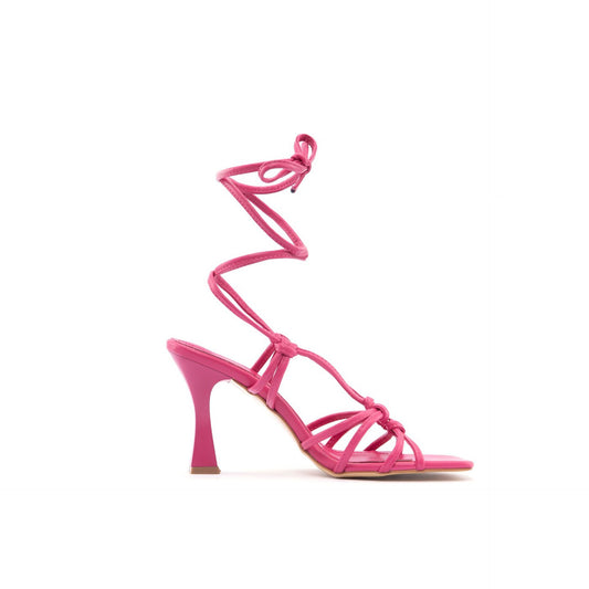 Elegant fuchsia-colored strappy sandals with a high heel, showcasing a stylish fashion attitude. Sofybrands Fashion Outlet