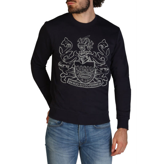 Elegant black sweatshirt with Aquascutum logo prominently displayed in embroidered silver design. Model is wearing the sweatshirt in the image. Sofybrands Fashion Outlet