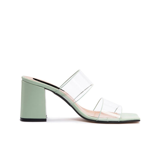 Chic mint green and transparent slip-on sandals with a block heel, showcasing a stylish fashion attitude. Sofybrands Fashion Outlet